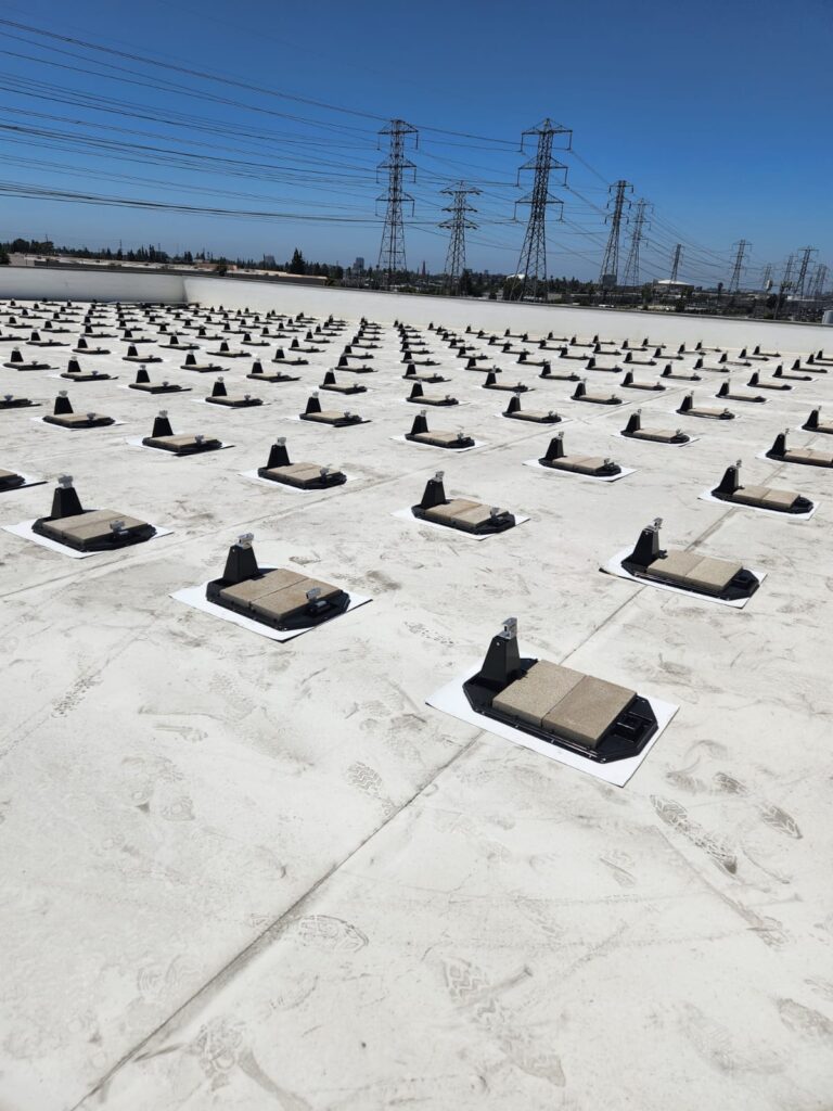 Electrical work and conduit management on the roof of a Public Storage building.